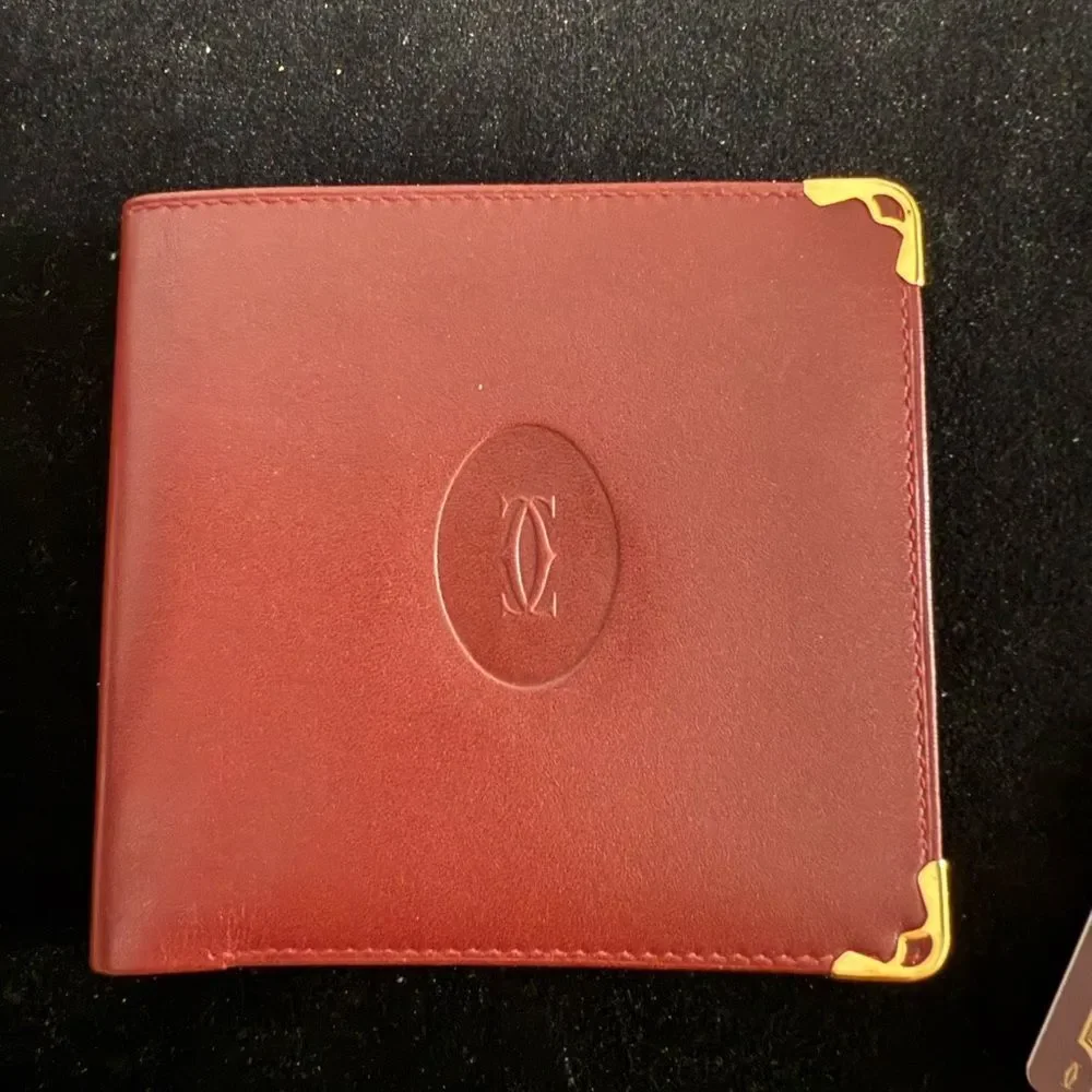 Never used Cartier red burgundy wallet comes with original box